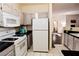 Efficient kitchen layout with essential appliances and ample countertop space at 1605 Crimson Hills Dr # 204, Las Vegas, NV 89128