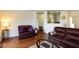 Open-concept living room with hardwood floors and comfortable seating at 1605 Crimson Hills Dr # 204, Las Vegas, NV 89128