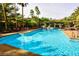 Inviting community pool with ample seating, lush landscaping, and relaxing cabana area at 1605 Crimson Hills Dr # 204, Las Vegas, NV 89128