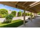 Enjoy the backyard's covered patio and beautiful landscaping at 1824 Dawn Ridge Ave, Henderson, NV 89074