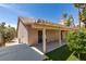 This backyard features a covered patio and beautifully landscaped yard, perfect for outdoor relaxation and entertaining at 1824 Dawn Ridge Ave, Henderson, NV 89074