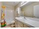 A standard bathroom includes a shower-tub combination, toilet, and vanity at 1824 Dawn Ridge Ave, Henderson, NV 89074