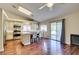 Open kitchen with stainless steel appliances, island, ample cabinet space, and backyard access at 1824 Dawn Ridge Ave, Henderson, NV 89074