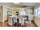 Well-equipped kitchen with stainless steel appliances, granite countertops and a dining area at 1824 Dawn Ridge Ave, Henderson, NV 89074
