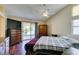 A spacious main bedroom offers lots of natural light and a sliding glass door to the outside at 1824 Dawn Ridge Ave, Henderson, NV 89074