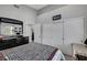 Well-lit bedroom featuring a queen-sized bed, modern dresser, and closet at 2052 Gravel Hill St # 207, Las Vegas, NV 89117