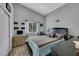 Well-lit bedroom features a window, closet, and wood-look floors at 2052 Gravel Hill St # 207, Las Vegas, NV 89117