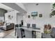 Elegant dining room with modern table, stylish chairs, and adjacent living area at 2052 Gravel Hill St # 207, Las Vegas, NV 89117