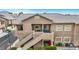 Charming condo featuring stairways to balcony, neutral color palette, and well-maintained landscaping at 2052 Gravel Hill St # 207, Las Vegas, NV 89117
