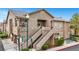 A well-kept condo featuring stairway, a neutral color palette, and lush landscaping at 2052 Gravel Hill St # 207, Las Vegas, NV 89117