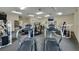 Bright gym with carpeted floor, including treadmills, weights, and exercise equipment at 2052 Gravel Hill St # 207, Las Vegas, NV 89117