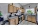 Well-maintained kitchen with stainless steel appliances, light wood cabinetry, and granite countertops at 2052 Gravel Hill St # 207, Las Vegas, NV 89117