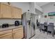 Eat in kitchen featuring modern stainless steel refrigerator and countertops at 2052 Gravel Hill St # 207, Las Vegas, NV 89117