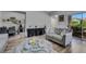 Cozy living room with modern furniture, wood floors, and natural light at 2052 Gravel Hill St # 207, Las Vegas, NV 89117