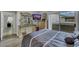 Comfortable main bedroom featuring coordinated furniture, sliding glass door, and decor at 2052 Gravel Hill St # 207, Las Vegas, NV 89117