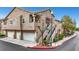 Inviting townhouse complex with attached garages and well-maintained landscaping at 2052 Gravel Hill St # 207, Las Vegas, NV 89117
