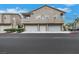 Inviting townhouse complex with attached garages and well-maintained landscaping at 2052 Gravel Hill St # 207, Las Vegas, NV 89117