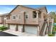 Inviting townhouse complex with attached garages and well-maintained landscaping at 2052 Gravel Hill St # 207, Las Vegas, NV 89117