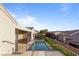 Backyard with private pool, patio, and lush landscaping creating a serene outdoor retreat at 2215 Bannerwood St, Henderson, NV 89044