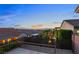 Scenic backyard view showcasing the surrounding neighborhood, mountain views, and vibrant sky at 2215 Bannerwood St, Henderson, NV 89044
