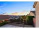 Serene backyard view overlooking neighboring properties and distant mountain views at sunset at 2215 Bannerwood St, Henderson, NV 89044