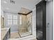 Bathroom featuring an updated shower, granite countertops, a white sink, and light blue walls at 2215 Bannerwood St, Henderson, NV 89044