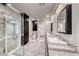 This primary bathroom features granite counters, dual sinks, and a glass enclosed shower at 2215 Bannerwood St, Henderson, NV 89044