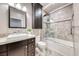 This bathroom has granite counters, a tub and shower combo, and vanity storage at 2215 Bannerwood St, Henderson, NV 89044