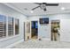 Bedroom featuring a modern ceiling fan, a mounted television and an exterior view at 2215 Bannerwood St, Henderson, NV 89044