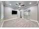 The spacious bedroom has plush carpet, a ceiling fan, and an ample closet at 2215 Bannerwood St, Henderson, NV 89044