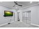 Neutral bedroom featuring carpet flooring, a ceiling fan, and a mirrored closet at 2215 Bannerwood St, Henderson, NV 89044