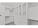 Bright walk-in closet featuring custom shelves, drawers, and cabinets for maximum storage at 2215 Bannerwood St, Henderson, NV 89044