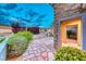 Welcoming front entry featuring stone pathway and well-manicured landscaping enhancing the curb appeal at 2215 Bannerwood St, Henderson, NV 89044