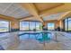 Indoor hot tub offers scenic views from the floor-to-ceiling windows in a luxurious setting at 2215 Bannerwood St, Henderson, NV 89044