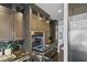 Gourmet kitchen with stainless steel appliances and custom cabinets for ample storage at 2215 Bannerwood St, Henderson, NV 89044