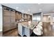 Modern kitchen boasts a spacious marble island with seating and custom cabinets for ample storage at 2215 Bannerwood St, Henderson, NV 89044