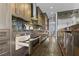 Modern kitchen featuring stainless steel appliances, custom cabinets, and granite countertops at 2215 Bannerwood St, Henderson, NV 89044