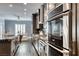 Gourmet kitchen featuring stainless appliances, granite counters, and wood floors at 2215 Bannerwood St, Henderson, NV 89044