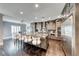 Spacious kitchen features a large marble island with seating, stainless steel appliances, and wood floors at 2215 Bannerwood St, Henderson, NV 89044