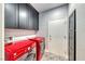 A convenient laundry room complete with storage cabinets and modern appliances at 2215 Bannerwood St, Henderson, NV 89044
