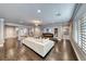 Large living area with a cozy fireplace, TV, plush sofa, and abundant natural light at 2215 Bannerwood St, Henderson, NV 89044