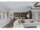 Comfortable living area with a white sectional sofa and open access to the modern kitchen at 2215 Bannerwood St, Henderson, NV 89044