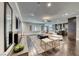 Spacious open-concept living room featuring modern decor, a comfortable sectional, and hardwood floors at 2215 Bannerwood St, Henderson, NV 89044