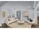Cozy living room featuring built-in shelves and hardwood floors, styled with neutral decor and natural light at 2215 Bannerwood St, Henderson, NV 89044