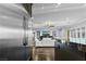 Open floor plan showcasing the living room with large TV and view from kitchen at 2215 Bannerwood St, Henderson, NV 89044