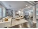 Beautiful open-concept living room with hardwood floors, neutral walls, built-in shelving, and modern furnishings at 2215 Bannerwood St, Henderson, NV 89044
