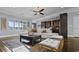 Spacious living room with large windows, hardwood floors, and stylish decor at 2215 Bannerwood St, Henderson, NV 89044