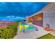 Backyard pool featuring manicured landscaping, creating a private outdoor oasis for relaxation and entertainment at 2215 Bannerwood St, Henderson, NV 89044