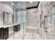 Modern walk-in shower features granite walls, a rainfall showerhead, and a built-in bench at 2215 Bannerwood St, Henderson, NV 89044