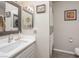 Bright bathroom featuring a white sink vanity and a shower with a striped curtain at 2240 Highpointe Dr # 203, Laughlin, NV 89029